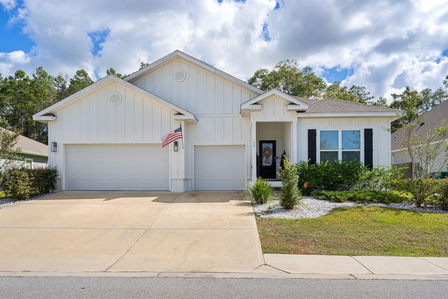 VA ASSUMABLE LOAN WITH GREAT RATE AVAILABLE! This beautiful modern home, built in 2021, offers 4 spacious bedrooms, 3.5 baths, and approximately 2,785 square feet of living space with a sought-after 'mother-in-law suite'. The interior is filled with natural light, tray ceilings, quartz countertops, a bright and airy floor plan, and luxurious finishes throughout. The gourmet kitchen boasts stainless steel appliances, an oversized island for ample counter space, and an open concept perfect for entertaining or gatherings. The owner's suite provides a peaceful retreat that includes dual vanities, a walk-in shower, soaking tub, and a large walk-in closet. The additional bedrooms are generously sized with well-designed jack and jill feature connecting two, a separate full bath in the 'mother-in-law' area, and a conveniently located half bath off the main living area. Outside, the home sits on a private 0.26-acre lot surrounded by mature landscaping that can be cleared or kept offering plenty of potential space for outdoor relaxation, play, a pool, gardening, and/or privacy. Located just a short drive from the beautiful white-sand beaches of the panhandle, as well as shopping and dining in our local or surrounding areas, this property combines small-town tranquility with easy access to coastal living and everything this area has to offer. Come check it out! 