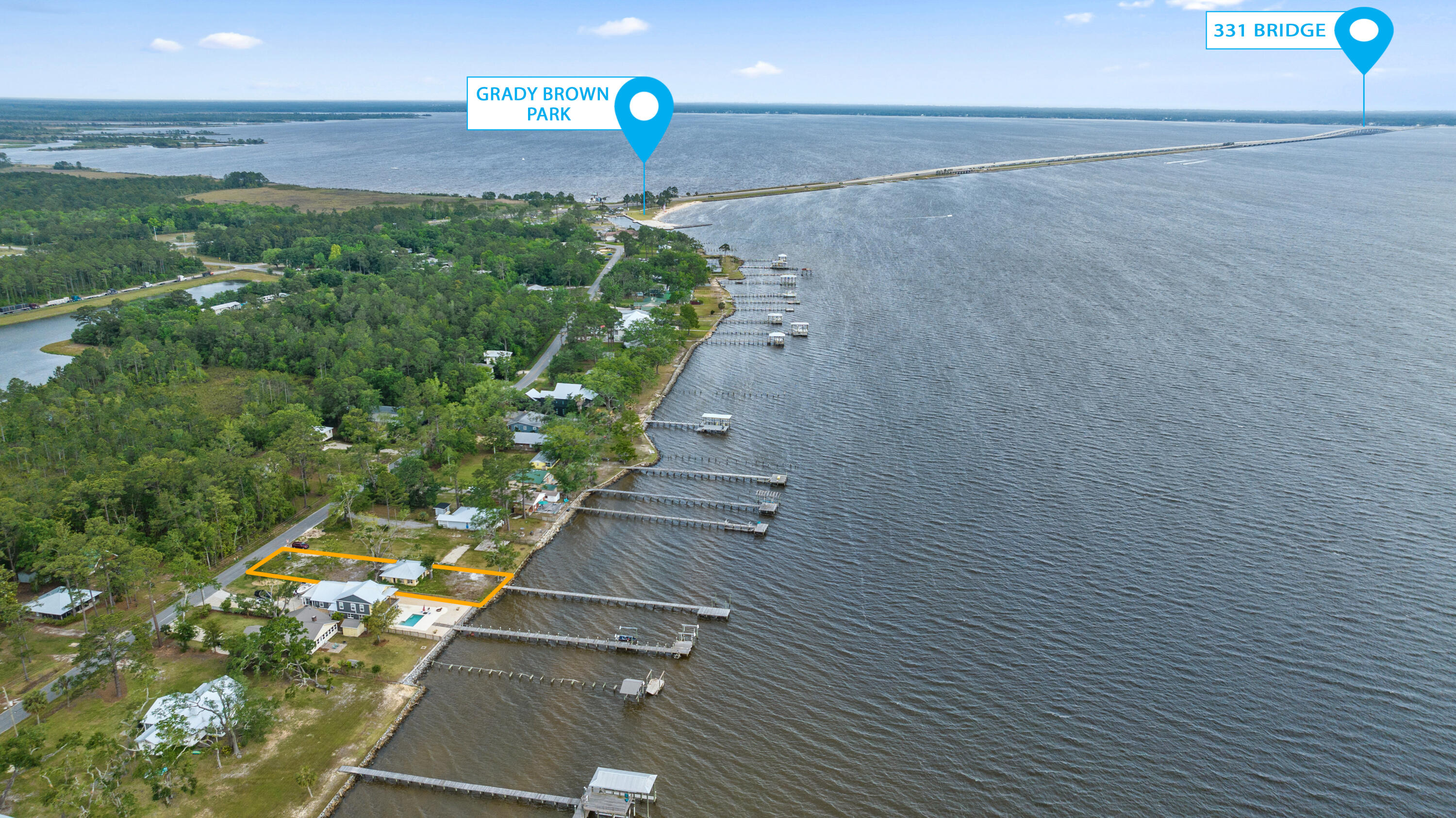 Welcome to 2518 Bay Grove Road! Introducing an opportunity to own a magnificent Bay Front lot with 60 feet of water frontage. This property boasts a private dock, allowing you to easily access the sparkling waters and embark on endless adventures.The single-story block home is ready to be restored, offering unlimited potential for customization and creating your dream waterfront retreat. Renovate the home to restore its charm or unleash your creativity and build your own masterpiece!With city water and sewer already in place, convenience meets functionality.Imagine indulging in breathtaking western sunset views every evening, setting the perfect backdrop for relaxation and tranquility. Watch the dolphins jump and listen to the