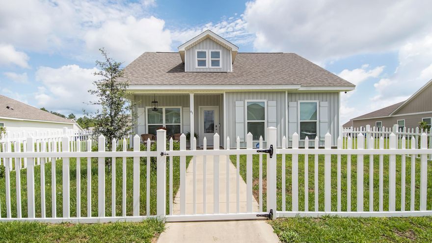 Welcome to 41 Woodsorrel Street, a charming 3-bedroom, 2-bath home located in the desirable Owl's Head subdivision of Freeport, FL. This popular Aspen floor plan spans 1,682 SqFt and offers carefully curated upgrades throughout, thanks to its owner, a talented interior designer.From the moment you arrive, you'll appreciate the attention to detail, starting with the inviting white fence and matching shutters, alongside the elegant white glass front door. Inside, the home is painted a serene sea mist color, creating a peaceful ambiance. Enjoy the comfort and style of ceiling fans in all bedrooms and the living room, as well as a stunning custom chandelier in the dining room. Practicality meets elegance with new knobs installed throughout and thoughtfully placed towel racks and toilet paper holders in the bathrooms. The durable hard surface LVP flooring throughout adds a touch of sophistication. 

As an added bonus, the washer, dryer, and refrigerator are included with the sale, making this home move-in ready. The Owl's Head community features a neighborhood park with paved walking trails and a spring-fed lake, offering the perfect setting for outdoor relaxation. Don't miss the chance to make this beautifully upgraded home your own.