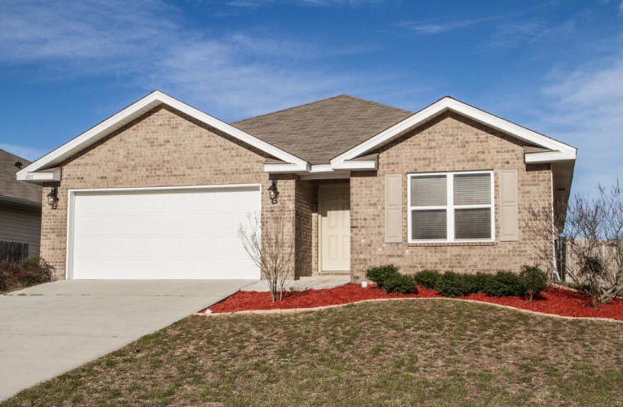 Newer home in South Crestview with 4/2 open concept floor plan. Easy access to bases, beaches and shopping. Vinyl plank flooring, carpet in bedrooms, newer paint, nice counter tops, nice cabinetry, eat in dining room, large living room, spacious laundry room, good size foyer with split bedroom floor plan. Colors are neutral, mature landscaping, large back yard, privacy fenced, and covered back patio.