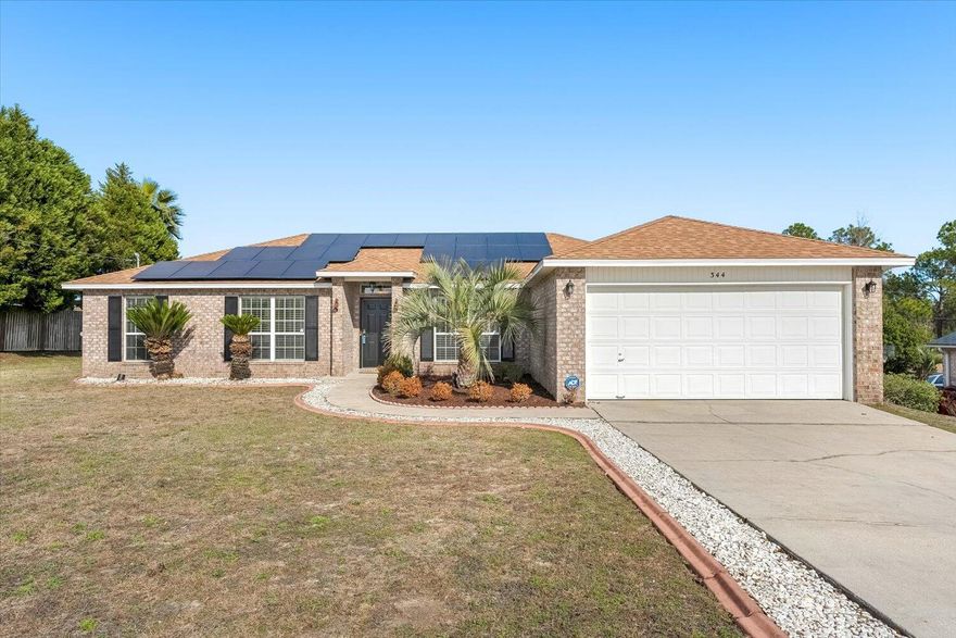Discover the allure of your new home in South Crestview, located in Countryview Estates just off PJ Adams Parkway, and easy access to local amenities. This 4-bedroom, 2-bathroom home is near Eglin, Duke, and Hurlburt Military Bases as well as Antioch Elementary. The living area, with Cathedral ceilings and a wood-burning fireplace, creates a cozy atmosphere. The kitchen features an island, breakfast nook, and separate dining space. Throughout the house, you'll find easy-to-maintain tile flooring, and recently installed Luxury Vinyl Plank (LVP) in the Master Suite. The Master Bath features double vanities, a garden tub, and a spacious closet. Freshly painted, this house is ready for you to make it your own. New HVAC in 2016. New Roof in 2019. Solar Panels Installed in 2020.