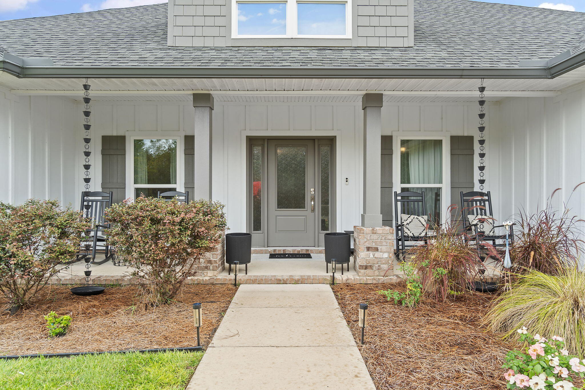 Experience luxury living in this custom 4-bedroom, 3-bath home located in Russell Bayou. This meticulously designed home boasts impact-resistant windows and doors, a gas tankless water heater, and a dedicated home office. The fully landscaped yard features a sprinkler system, and the exterior is enhanced with craftsman-style trim, a covered back porch, an inground saltwater pool with a tanning shelf, and a fenced yard. Inside this gorgeous home- a spacious great room offers built-in cabinets, a tray ceiling, and a beautiful electric fireplace with a floating mantel. The gourmet kitchen is a chef's dream, offering a gas cooktop and all stainless steel appliances, including a counter-depth French door refrigerator, an open chimney hood, a dishwasher, a built-in microwave, a wall oven, and a large pantry. The counter-height island features an oversized sink and a custom trash pull-out, perfect for functionality and style. Adjacent to the kitchen is a cozy breakfast nook and a formal dining room with an elegant tray ceiling.
The private primary suite is an oasis of comfort, with a tiled shower, an acrylic tub with a tile surround, double vanities, custom mirrors, and a water closet. The large walk-in closet has built-in linen storage. Two additional bedrooms share a hall bath towards the front of the house, while a guest suite offers a private bath, ideal for visitors at the back of the house.
This home is located just minutes from a public boat launch, parks, and stunning beaches. Within 15 minutes from the back gate at NAS, 15 minutes from Orange Beach, and 20 minutes from Downtown Pensacola. Don't miss your opportunity on this great property. Schedule your appointment today!