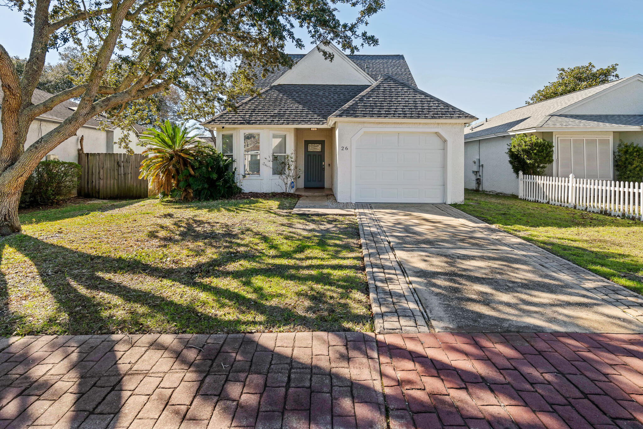 This cozy Florida Cottage style home features 3 bedrooms, 2 bathrooms and an upstairs bonus area that can be used as a loft, 2nd living room, playroom or office. Both bedrooms upstairs have an exit to the balcony. The master bedroom is on the 1st floor.  As you walk in, you'll notice the vaulted ceilings and open space.  The kitchen has stainless steel appliances, tile backsplash and a quaint breakfast nook. Enjoy your coffee or wine out back on the deck! ROOF is 2020.HVAC is 2020.