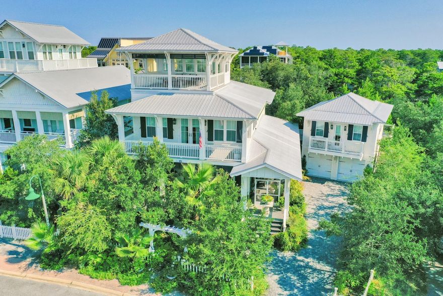 This elegant, beach cottage home has it all! Newer construction in gated Old Florida Beach subdivision, built in 2013. is immaculate and never rented. 4 Bedroom and 4 Bath, including a full guest quarters over a 2-car garage that includes space for a workshop or additional storage. The main house has an open floor plan and a chef's kitchen. The oversized master bedroom includes two sitting areas and private balcony. Enjoy the expansive views of the Gulf and Draper Lake from the open air 3rd floor covered terrace big enough for entertaining or enjoying sunrises and sunsets. This home is a must see!