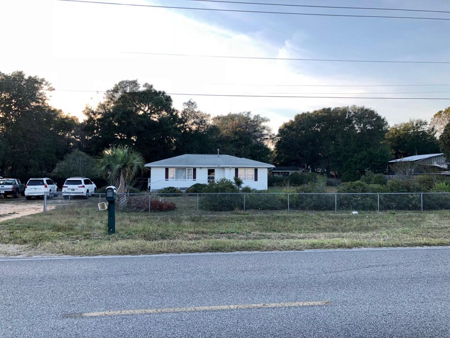 A rare find, 4 contiguous lots with a house and outbuilding. Each lot is 65 x 128, making 4 lots 260' of road frontage on Denton Blvd. Property is Zoned R-2 (Suburban Residential) which allows single family, multi family, C-1 and C-2 zoning. Property is fenced all around, mature fruit trees and azaleas along the back fence. There are 3 bedrooms, 1 3/4 bath, large laundry room, oak flooring in all rooms except bathroom, kitchen and laundry room. New ac unit has been installed within the past few years . Home is sold ''AS IS'', will be sold unfurnished and no appliances will convey.