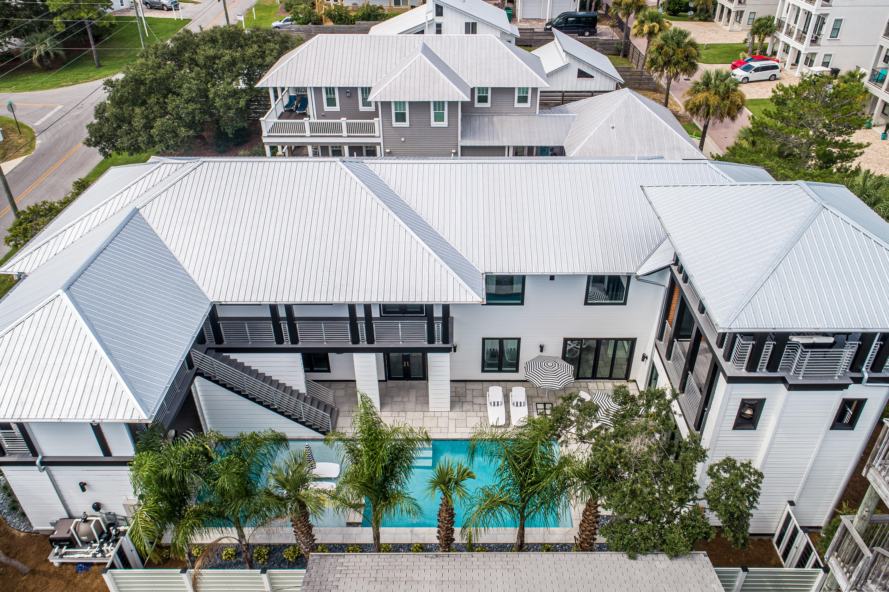 Come Fall in Love with this Amazing home on the WEST side of 30A, where life seems to slow down! This ICONIC home offers gulf views, lake views, a private pool, public beach and private deeded beach access.  With 5100 sqft of Architectual style designed by Tyler Doin and built by Wes Limbach, this house is a true one of a kind!  The uniqueness of this 7 bedroom/6 bath home will leave you in awe!   Kimberly of Tipton-Valentino Designs has brought her Boho Modern Style to 30A with a twist to every room. You will not want to miss seeing this amazing home!  Courtyard entrance greets you with tranquility! Unwind and relax as you see and hear the flow of fountains and bubbles from the amazing pool and spa..  Enter the home and immediately fall in love with the featured art wall and open st