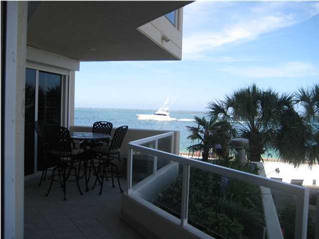 BRING ALL OFFERS!!!The views from this condo are some of the best anywhere from inside the condo or from its two large balconies!! East Pass Towers II is a non-rental building with pool, hot tub, community room and exercise room overlooking the Destin Pass. This beautiful condo is 2nd floor level as parking garage is on the first floor,this condo comes with a garage also. Lovely tile throughout with master on one side of condo and guest bedrooms and baths on the other side. All bedrooms have sliding doors to the balcony. This condo features electric hurricane shutter for ease and piece of mind, lovely plantation shutters on sliding doors, new A/C in 2010, speakers in all rooms with volume control, separate bar with ice maker, whirlpool tub and separate shower in master with double