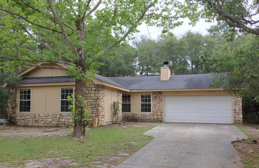 What an ideal location for serene, peaceful beach and lake living. 102 Camp Creek Road South is located across the street from the unique Coastal Dune Lake, Camp Creek Lake and about 500 yards to the public Gulf beach access on 30-A. The street has no thru traffic. Home sits on a large lot with mature trees and plenty of room to expand. Needs a little TLC, but what a jewel you could have with just a few renovations. Vaulted ceilings in living area and master bedroom. Dining area overlooks big back yard. Fireplace in living area for those chilly winter evenings. Across the street from community lake access. Bathrooms need ceiling repair so Owner has priced home for these renovations. Wood like flooring in living area, bedrooms. 2 car garage. Owner is selling property ''As Is''.