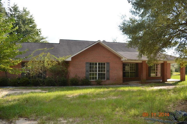 Country living! This large home was built in 1997 comes with 3 bedrooms, 2.5 baths, and rests on nearly 10 acres. This all brick home is 2400sf has a large open front porch and a large deck in the rear of the home. Inside you will find plenty of room with wood tongue in groove paneling in the family room. A large fireplace is here as well! Separate dining area, large kitchen and oversized rooms. The laundry room is just off the garage and kitchen and is oversized as well. This home needs some work so it may not qualify for all financing, but has tons of potential! ** Employees and family members residing with employees of JPMorgan Chase Bank, N.A, its affiliates or subsidiaries are strictly prohibited from directly or indirectly purchasing any property owned by JPMorgan Chase Bank, N.A. **