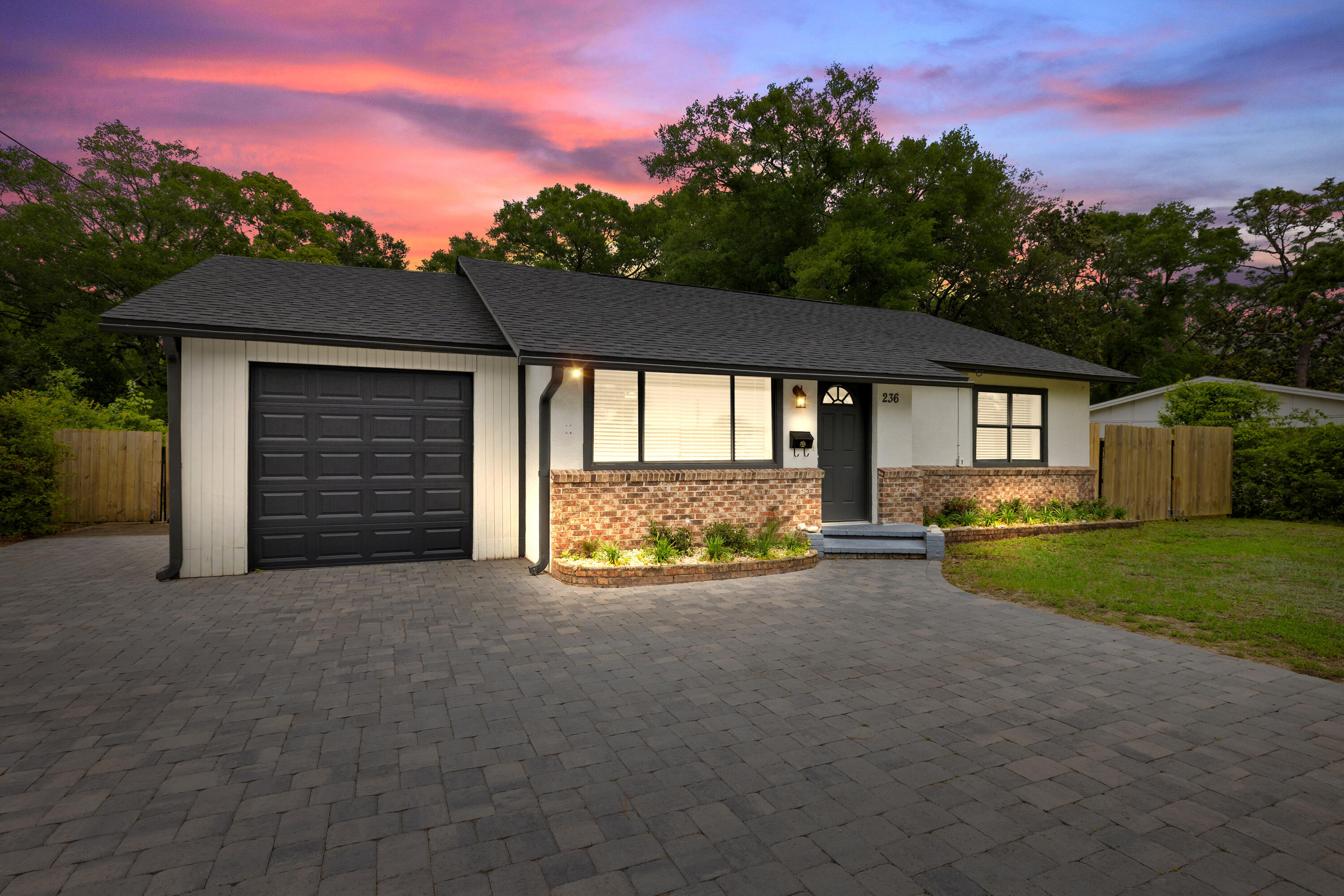 Fully Renovated & Move-In Ready - Modern Comfort Meets Functionality. This beautifully updated home, with a 2015 effective year built, offers exceptional value, comfort, and style. Thoughtfully upgraded from top to bottom, it's designed for easy living and long term peace of mind. Inside, the home features a fully renovated kitchen and bathrooms with granite countertops, along with new laminate flooring throughout--including the master bedroom--for a clean, modern finish. Spacious Laundry room right off the kitchen. There is fresh interior and exterior paint, and updated lighting and ceiling fans throughout the home. Additional features include a brand new 1-car garage, new paver driveway and a brand new screened-in patio. Out back, you'll find double gates for RV or boat storage, a dedicated workshop/2nd garage, and an extra space ideal for a home gym or hobby room.