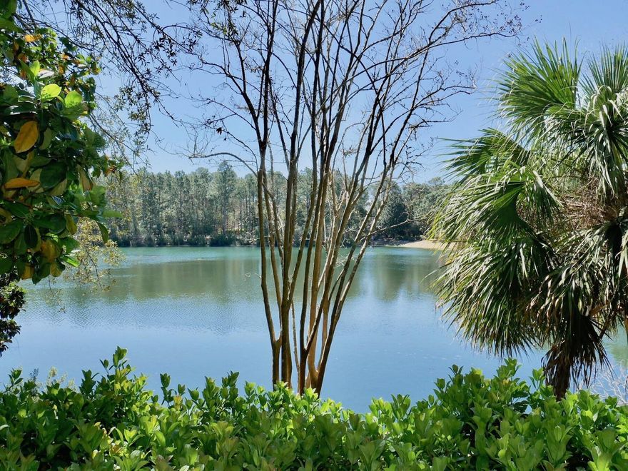 Custom built LAKEFRONT home in Bluewater Bay on a large .38 acre lot with 117' on picturesque Hidden Lake!  This home will be the perfect fit for someone wanting to enjoy the care-free Florida lifestyle Bluewater Bay has to offer. There are 2 large bedrooms, 2 full baths as well as an open living and dining area and an oversized garage.  Almost all of the rooms have large windows facing the lake offering peaceful and serene lake views. The deck along the back of the house is the perfect place to unwind while enjoying the sunset over the lake. There is plenty of room to expand or build on if desired and with just a little bit of updating, this home can be a showcase waterfront home!  Welcome home