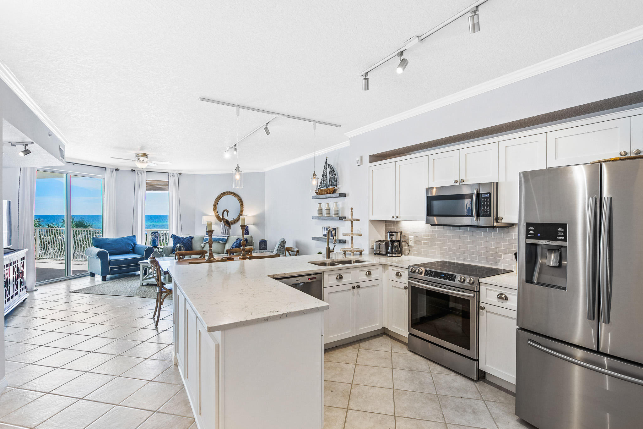 The perfect family getaway property awaits you at the Dunes of Seagrove. From the breathtaking Gulf views via the spacious balcony to the easily accessible resort pools, there is something for everyone here.  This 2BR/2BA + bunk room condo is recently updated and is offered fully furnished so you can enjoy the amenities immediately! The master suite features Gulf views, a cozy sitting area, double vanity and spa tub for the ultimate relaxation experience. A bright open kitchen with ample quartz countertops and stainless steel appliances is perfect for family gatherings and entertaining. This second floor unit allows easy access to all the amenities Dunes of Seagrove has to offer: beach front, two pools, hot tub, tennis court, fitness center, and more. A rare bonus is the dedicated garage