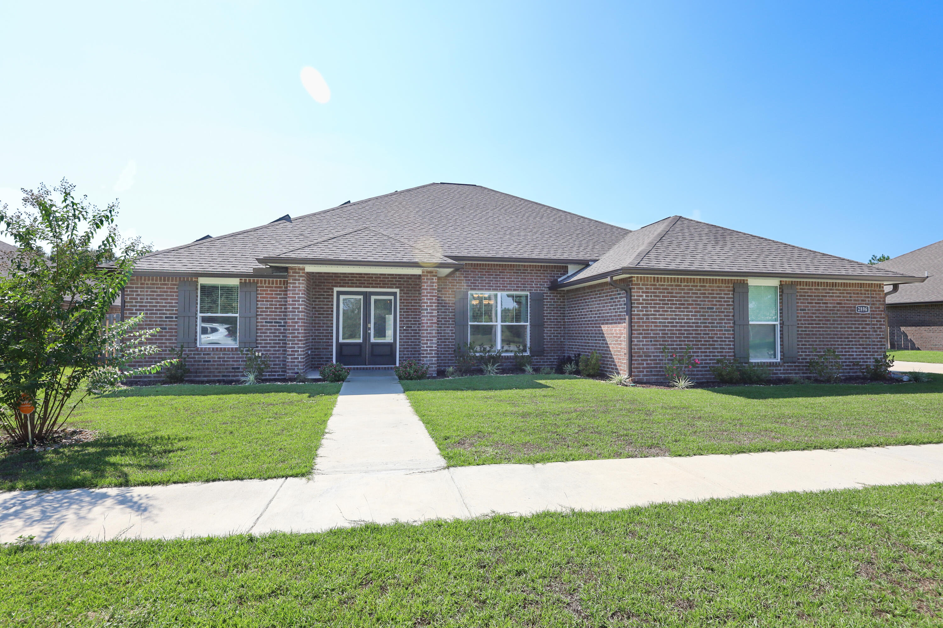 Assumable VA Loan @ 2.5%, or Up to $11k in buy-down points! In the gated community of Chanan Estates South of I-10 the home backs up to a pond and trail. Built in 2o22 this home has already received many upgrades. Key Features Include:Solar Panels, Whole Home Air Purifier, Whole Home Water Filter & Softener, Privacy Fence, Shed, 3 Car Garage, Open Kitchen w/ Granite Breakfast Bar, Shaker White Cabinets Accented w/ Crown Molding, French Gray Porcelain Plank Tile,10' Ceilings, Separate Dining & Breakfast Nook.Gorgeous master suite fitted with tray ceiling & back-lit crown molding, his & hers walk-in closets w/built-in shelving, double vanity, tiled shower w/ Topaz Pebble floor, & oversized soaking tub.The large bonus room upstairs is perfect for your home office! Buyer to verify info.