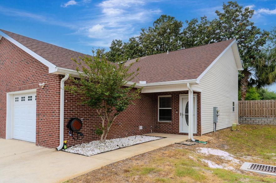 WOW! This Quail Run end-unit townhome truly outshines the rest! This isn't your average landlord special; the seller has resided in the home and has been meticulous about every inch. Pride of ownership is evident in the NUMEROUS upgrades that make this home move-in ready and perfect as a primary residence or long-term rental investment. The new roof and newer water heater provide peace of mind. The primary bedroom and bath are situated conveniently on the first floor while two additional bedrooms share a hall bath upstairs. Both bathrooms are COMPLETELY renovated with modern vanities, fixtures, flooring, and sleek tile tub/showers. Vaulted living room ceilings make it feel spacious and the dedicated dining area provides plenty of space for a table. New front and back doors, fresh paint, and wood-look flooring enhance the appeal. Not only that, the kitchen features quartz countertops, a new refrigerator, and a new kitchen window. Plus, MORE enhancements are on the way! By mid-May there will be brand new carpet in the downstairs bedroom, a new kitchen stove, and a custom security storm door on the front. The home sits by the cul-de-sac with a driveway that fits 2 cars and an attached one-car garage with stylish epoxy flooring and built-in racks. The back patio is enhanced with pavers and surrounded by a privacy fence. HOA dues are reasonable at only $370 quarterly and includes grounds maintenance and the relaxing community pool. Quail Run is located in the heart of Destin; only minutes from a myriad of shopping and dining options, the Destin Harbor, and the beautiful beaches of the Emerald Coast! Schedule your showing today
