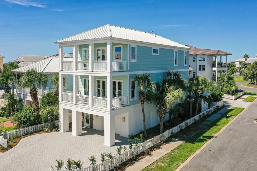 Exceptional vistas and attention to detail define this newly renovated coastal retreat. The owner of this Beach Home will enjoy uninterrupted views of lake Christina and the Gulf of Mexico. This freshly renovated home features new flooring, wood ceilings, shiplap walls, renovated bathrooms and a well appointed kitchen with new quartz counter tops, cabinets, stainless steel appliances and mosaic tile backsplash. The first floor boasts a unique Beach Cave with a covered hot tub, coupled with foosball, shuffleboard, ping pong, and a 70'' TV that make this an ideal outdoor entertaining area. The 2nd or main floor features a bunkroom with three full beds, and a separate guest suite with its own private balcony. Also on the main floor is the open concept living, dining and kitchen area, more