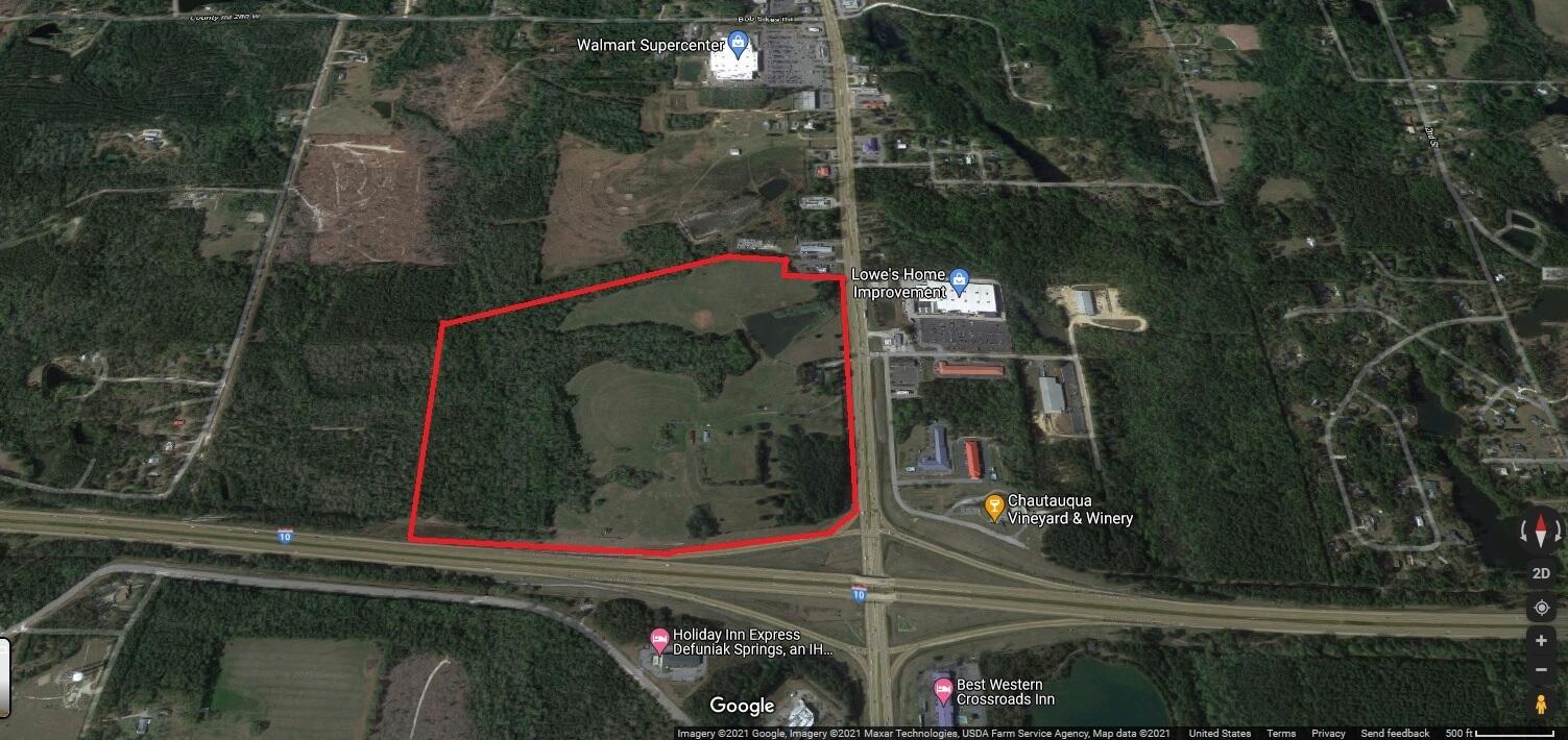 This apex location parcel at the junction of 331 S and Interstate 10 in Defuniak Springs is a developer's dream. 94.7 acres (110.4 per GIS map) with an estimated 75+ developable uplands (wetlands estimated at 20+ acres) is co-zoned commercial and residential (16 units per acre) for maximum value and use. This longtime family farm property has a prominent lake on the eastern side and forested wetland stream areas to the west. The property is the cornerstone parcel of the commercial zone along 331 in south Defuniak Springs with Walmart and Lowes along the same stretch and falls within the City of Defuniak Springs zoning jurisdiction. On the south side of I-10, almost 3,850 residential units are planned by several development groups. The approximate one acre parcel on the south side of I-10