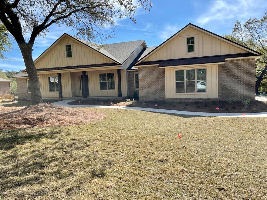 Absolutely gorgeous new home with an amazing view of Rocky Bayou Golf Course and lakes. Built by a local, family-owned builder with over 40 years experience in custom residential home design and building - this home exudes customs architectural design and features! A few of the many interior features include 10' ceilings in the main area with oversized crown moulding, arched openings, built-in and a beautiful stone fireplace /media center.  Its' open floor plan allows for wonderful natural light and views throughout the home.