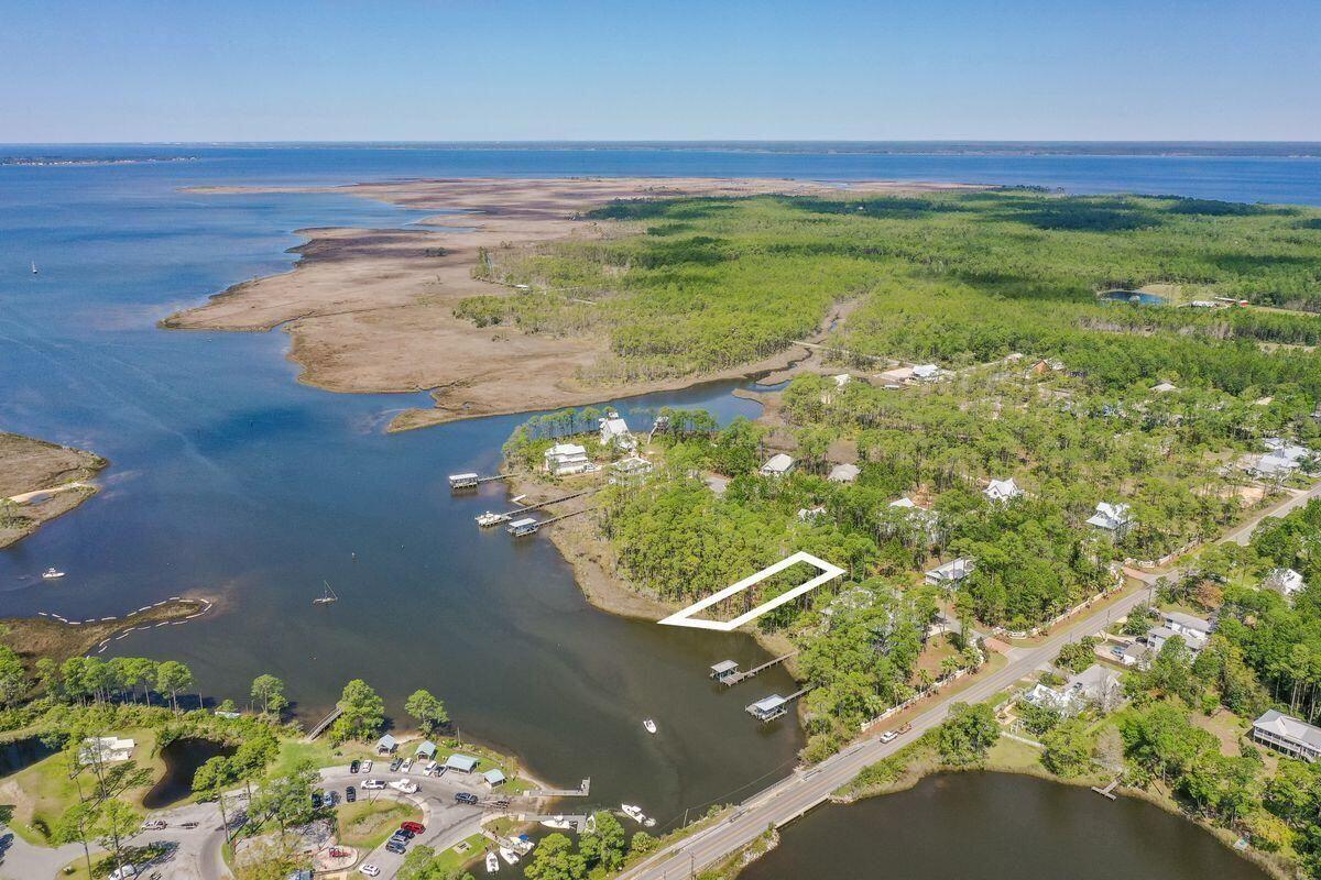 This bayou front homesite offers approximately 56ft of water frontage on Hogtown Bayou with direct access to the beautiful waters of the Choctawhatchee Bay. Cessna Landing is a private, gated community located north of US Highway 98 via County Highway 393. This gated community offers a pool with a pergola covered sun deck and restrooms, and community dock access. Directly across from this lot is the the public Cessna Landing Park and boat launch as well. Experience all that waterfront living has to offer right here and build your dream home; boating, fishing, kayaking, yolo boarding and more can all be accessed directly from your backyard. All HOA, building requirements and survey are available upon request. There are no short term rentals allowed in Cessna Landing.
