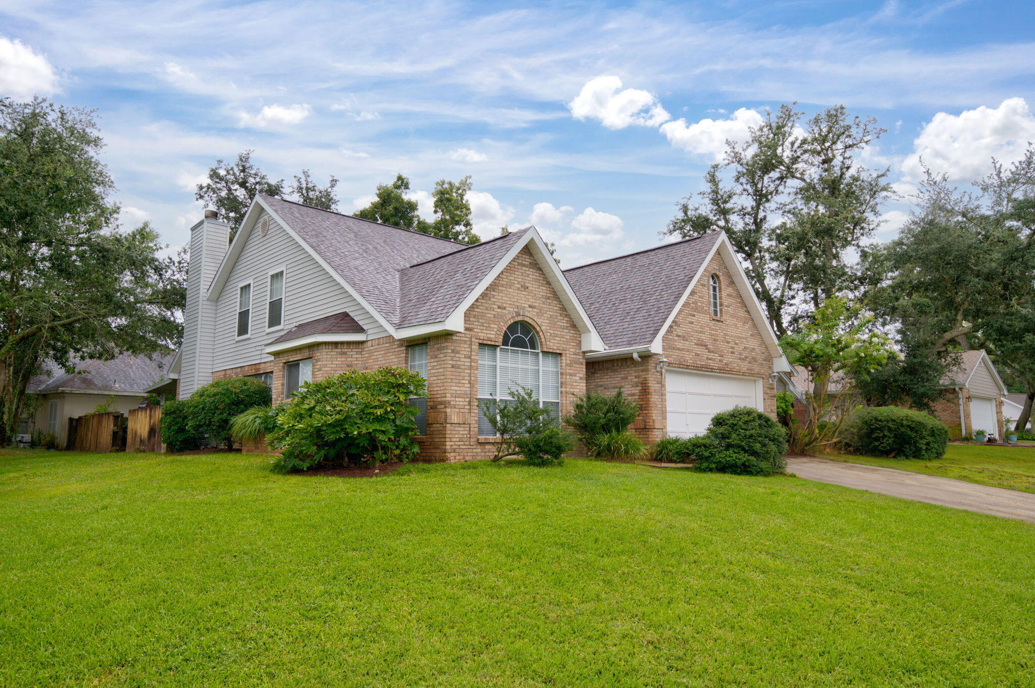 Welcome to 2812 Lee Trevino Court in Shalimar, FL, a stunning brick-featured family home nestled in the tucked-away community of Lake Pointe, perfect for privacy and great for walking, socializing with neighbors, activities, golf and tennis, or exercising with limited commuting traffic. Conveniently located just 4 miles from the West Gate of Eglin Air Force Base.  12 miles from Hurlburt Air Force Base, and 18 miles from Duke Field, making it an ideal location for military personnel, Contractor employees and Civil Service staff. The home is situated on an elevated corner lot with landscaping and a private fenced backyard. The roof was updated in 2022, and the HVAC system was upsized in capacity and replaced in 2018. Step inside to discover a spacious and inviting eat-in kitchen, complete with a breakfast bar, a Jenn air-type stove range top, and built-in oven and microwave. The kitchen seamlessly flows into the dining area, making it perfect for gatherings and entertaining guests. The large master bedroom suite is located on the main floor. It features a whirlpool tub, a separate shower, double vanities, and a generous walk-in closet. Upstairs, you'll find a loft space that can be transformed into an office, study, play area, or media room to suit your needs. The fenced backyard is an ideal spot for relaxation, featuring a covered patio perfect for outdoor dining or simply enjoying the fresh air. The yard extends beyond the fence, providing ample space for outdoor activities. Recent updates include a new garage opener and a new lawn pump that utilizes the aquifer to keep the lawn lush and green. The great room is a highlight of the home, with its vaulted ceiling, gas fireplace, and French doors leading to the patio. The separate dining room and tile floors add to the home's features. For outdoor enthusiasts, there are several community parks and recreational activities nearby. Meigs Park Boat Ramp, located just 2 miles away, offers a public boat launch. Shalimar Pointe Golf Club, only 3 miles away, provides a beautiful golf course and clubhouse. For boating enthusiasts, the Shalimar Yacht Basin is just 4 miles away, offering boat launch facilities and marina services. Rest assured that you will love the home and will quickly adapt to all of the amenities and advantages that living in Lake Pointe provides.