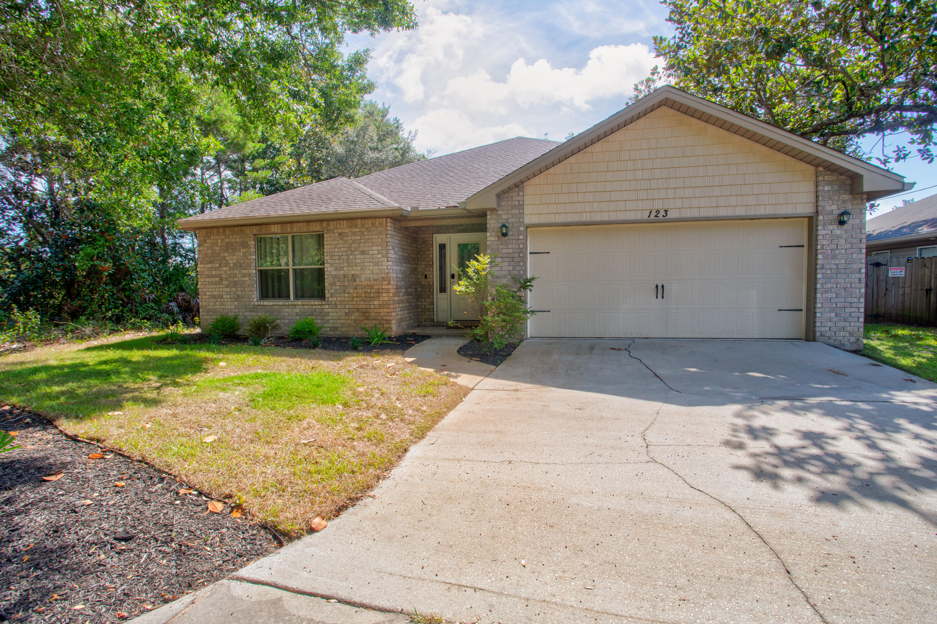 FULLY FURNISHED & MINUTES TO HURLBURT FIELD AFB! This 3BR/2BA home is located at the end of a quiet street, backed by the Eglin reservation for added privacy. Ideal for first-time buyers or investors, it's completely move-in ready and just minutes from the beach. Features include granite countertops, birchwood cabinets with soft-close drawers, stainless steel appliances, wood plank tile and crown molding. The spacious master has a walk-in closet and large tiled shower. Enjoy a new HVAC system, covered back patio, and fenced backyard perfect for relaxing or entertaining!