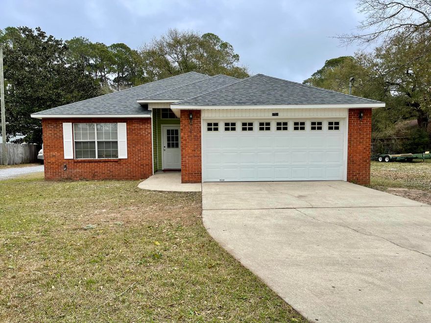BRAND NEW ROOF on this great 3 bedroom 2 bath home located in the heart of Niceville!!! Built in 2004 this home offers a split bedroom floor plan with Master on one side and additional bedrooms on the other. Master bath features tile flooring, shower/tub combo, double vanity and walk-in closet.  Spacious Living Room is off of the kitchen and dining area and features vaulted ceilings.  Kitchen offers wood cabinetry, stainless refrigerator, dishwasher and microwave, tile flooring, pantry and breakfast bar.  Dining area leads outside to a covered patio and deck overlooking the fenced in back yard. This home is conveniently located to restaurants, shopping and schools.  Call today to make your appointment before this home is gone!  $3,500 carpet allowance provided to buyer.