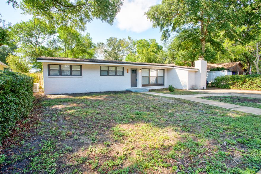**Assumable Loan @ 2.25%** Welcome to this beautifully updated 4-bedroom, 2-bath home located in Valparaiso, FL! With 2,013 sf of thoughtfully designed living space, this home perfectly blends comfort and functionality. Step inside to a bright and airy open-concept living area featuring new flooring throughout, creating a modern and cohesive feel. The spacious living room seamlessly flows into the dining area and updated kitchen, which boasts sleek countertops, cabinetry, and high-end appliances, perfect for entertaining. Conveniently located just minutes from local schools, shopping and Eglin AFB.This home truly checks all the boxes: updated, spacious, and move in ready. Schedule your showing today, and experience everything this beautiful Valparaiso home has to offer.