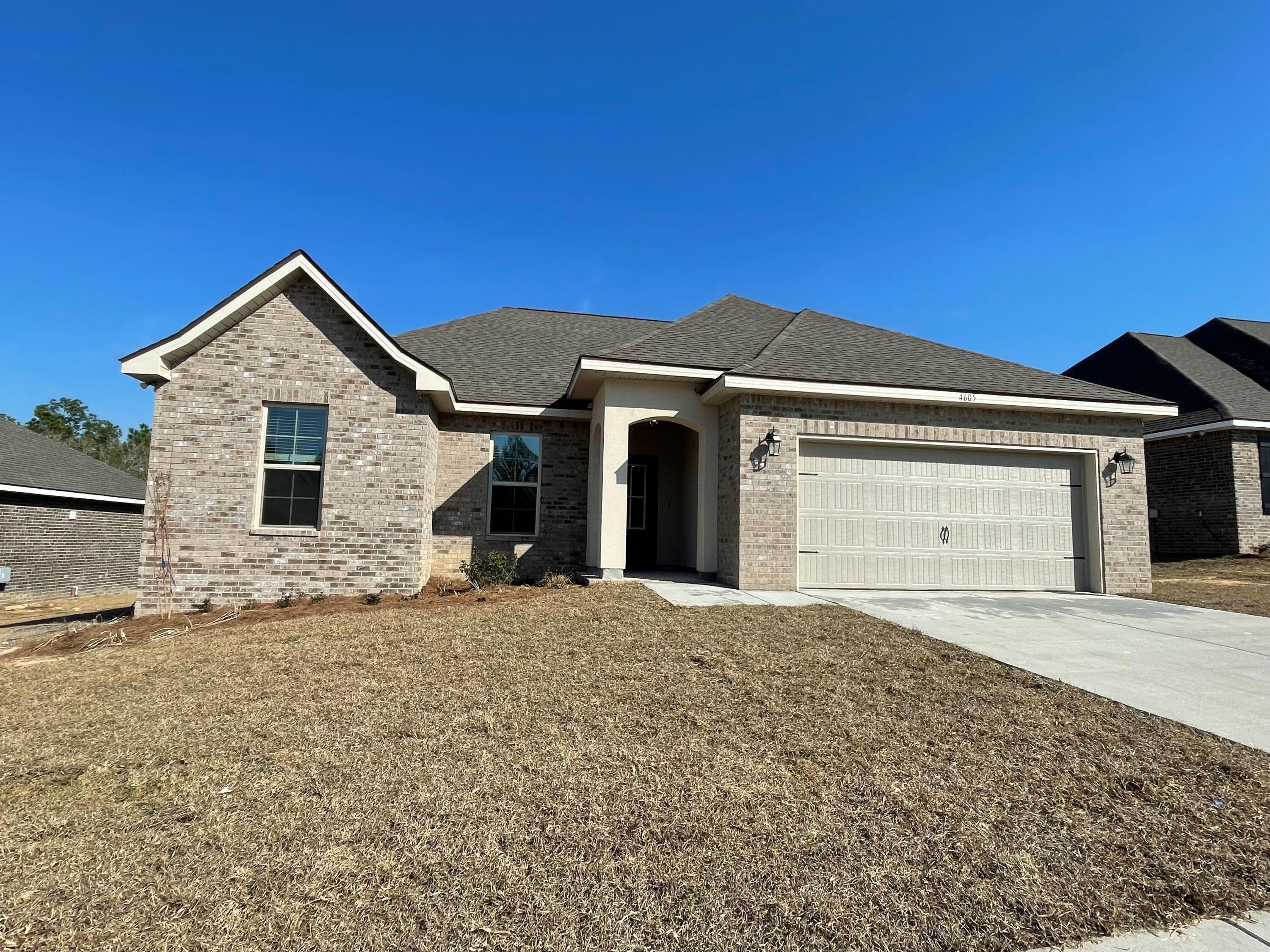 Awesome Builder Rate Incentives! (Restrictions apply) The RAVENSWOOD V B in Patriot Ridge community offers a 4 bedroom, 2 full bathroom, open design. Upgrades added (list attached).Features: double vanity, garden tub, separate custom tiled shower, and 2 walk-in closets in the master bath, ceiling fan in living room and master bedroom, kitchen island, recessed can lighting in kitchen, covered porch and patio, crown molding, undermount sinks, framed mirrors, smoke and carbon monoxide detectors, landscaping, architectural 30-year shingles, flood lights, and more!Energy Efficient Features: electric water heater, a kitchen appliance package with a electric range, vinyl low E MI windows, and more!