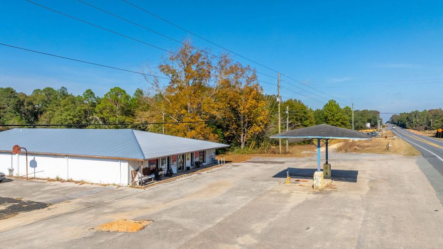 Great Investment Opportunity!This versatile commercial building offers 7,900 sq ft under roof, including 5,216 sq ft of heated/cooled space and a 1-bedroom apartment--perfect for living onsite while operating your business.Previously home to a well-known local store that has served the community since 1980, this property is ideal for reopening a store/ gas station and/or deli to meet the needs of this rapidly growing area.The owner is open to seller financing, making this an even more attractive opportunity.Contact me for complete details!