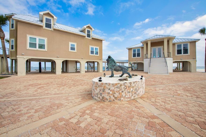 OVER 500' OF WATERFRONT, WRAP-AROUND WATER VIEWS, PRIMARY HOME, GUEST HOUSE, POOL, BOAT DOCK & PRIVATE BEACH! Introducing 320 Sunny Drive, THE Crown Jewel of Emerald Coast Waterfront with over 180-degree views from the Santa Rosa Sound to the Gulf.  The 3B/2.5B main residence boasts views that will absolutely take your breath away!  The first floor open concept is an entertainer's dream, while the second floor is a relaxing primary retreat. Even the separate 3B/2.5B guest house features water views from almost every room.  The expansive waterfront pool patio is surprisingly secluded, with paved paths leading to the private beach, boat dock (2018), fire pit, shuffleboard and chess. Parking is abundant and Tesla ready. Inside Sandy Pointe, a gated community, 320 Sunny Drive is a MUST SEE!