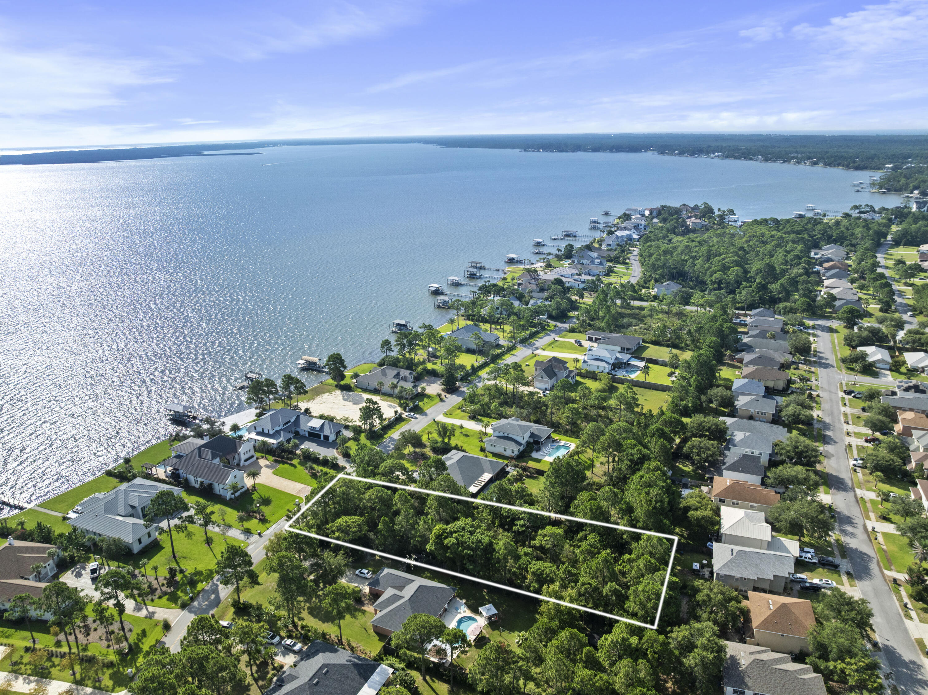 Build your Dream Home on this .63 acre lot in the highly sought after Driftwood Estates Community, which is situated minutes from the Beaches of South Walton and 30A. Community features include a well maintained Community Pool, ponds, sidewalks, street lights, parks and beautifully landscaped common areas. Driftwood is positioned minutes from Sacred Heart Hospital, Top-Rated Schools, shopping, dining for all occasions, entertainment, Sandestin Golf and Beach Resort and Grand Boulevard. Within a 1/2 to the water this lot features views of the Bay where once you build the perfect beach house you can enjoy the views with your morning coffee or evening wine. Call today for your showing as this property won't last long!