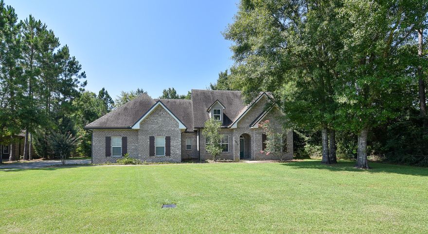 Beautiful Randy Wise built home in a lovely neighborhood features stainless steel appliances, a large center island in the kitchen and granite countertops throughout. Beautiful hand scraped wood floors, upgraded oil rubbed bronze lighting fixtures, crown molding and 9 ft. ceilings grace this move in ready 2,200 square foot stunner! The master suite bath has a custom tiled shower and double vanity. One of the additional bedrooms has it's own bath, so guests or family are afforded extra privacy. The home has gutters, a huge privacy fenced backyard and lovely covered patio for outdoor entertaining. All this home needs is proud new owners to enjoy it!
