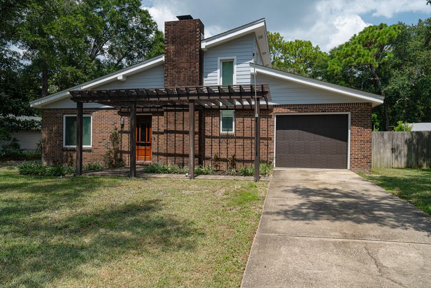 Large 4 bedroom home within 20 minute drive to Hurlburt Fld or Eglin AFB.  Enter into spacious Living room.  Follow through to large kitchen with island.  Stainless Steel Appliances and White Shaker cabinets and Granite counter tops. Open plan flows to left with good size dining room.  Door from  Dining room opens to large Fenced backyard with patio. Master Bedroom is upstairs with Master Bath, double vanities, tub w/shower and walk in closet.  Other three bedrooms are downstair and share a full bath.  All bedrooms have carpet,  Living room. kitchen and dining ae have wood look tile.  Home was renovated and updated in 2019.  NON  SMOKING HOME.  PET CONSIDERED WITH OWNER APPROVAL AND PAYMENT OF NON REFUNDABLE FEE.  FULL LAWN  SERVICE INCLUDED IN RENT.