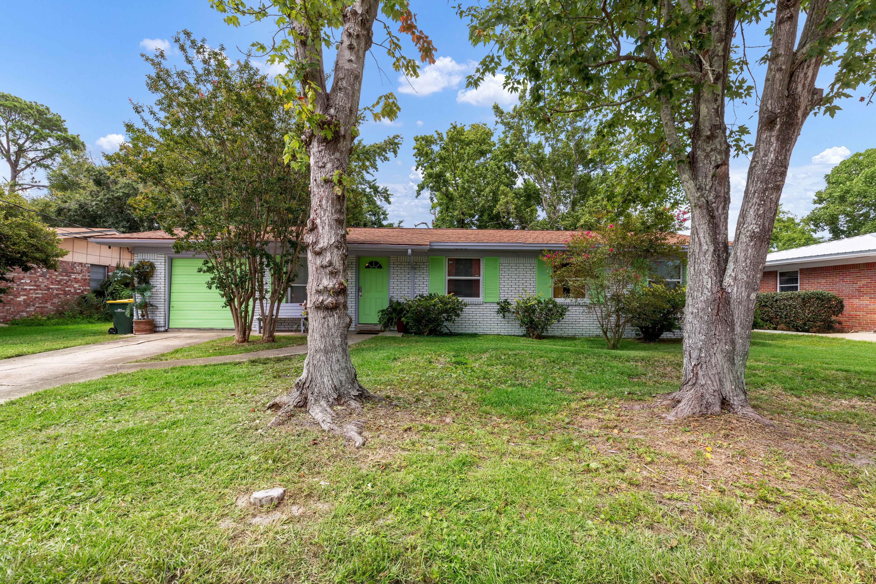 OPEN HOUSE SUNDAY 1-3pm. All brick fully furnished 4 bedrooms and 2 bathrooms home is being run as a successful BNB. Jan-Jun 2024 (6 months) earnings are $21,365.00. $31,000 (for 10 months). You have a 1 car garage to accommodate your guest's jet ski or kayak. The owners did a great job in remodeling. Open concept in the dining, living and kitchen. Sliding glass doors in the dining. Great for natural light. The kitchen has a door that leads to the back yard to make Grilling easy. You have a hall to your right. 2 bedrooms are to the right of the hall with the full guest bathroom on the left of the hall. At the end of your hall is the 4the bedroom. large Master is to the left with your full bathroom. Fenced in back yard. Great furnished home or run it as a BN