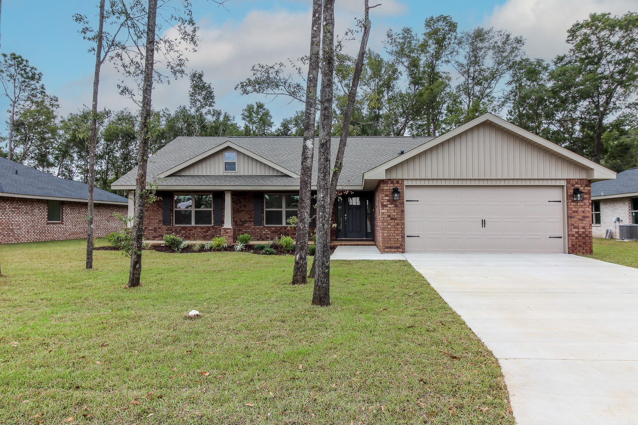 Looking for a 4 sided brick home with 4 bedrooms and 2 full baths? Look no further! This 1920 sq ft home offers that and so much more! Upgrades include granite in the kitchen with a breakfast bar too! The floors are upgraded with core tec pro-plus and bedrooms are carpeted. The master has a garden tub as well as a walk in shower. The master bedroom has a trey ceiling.The master and the great room come with ceiling fans but all other rooms including covered porch are secured and hard wired to make fan installation easy. The back patio has been upgraded to a 14 x 16 covered porch to enjoy the outdoors even if there's rain. The yard is fully sodded with sprinklers too! This home comes with a 10 yr Bonded Builders Warranty and will not disappoint.