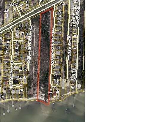 Under Option - Taking Back Up Offers.  7.809 acres fronting both Hwy 98 and the Sound. (or purchase with adjoining lot to have 15 total acres) 230' front feet on the Highway by approx 350' deep is zoned HCD (Highway Commercial Development.) The remaining approx 1270' X 210' going to the water is zoned R1 (Single Family Residential.) Because of the elevations, the waterfront, and potential residential subdivision, much of the property should have from minor to excellent waterfront views. Buyer to verify information is accurate and up to date. Arial photo, survey, and site plan for possible development are available.
