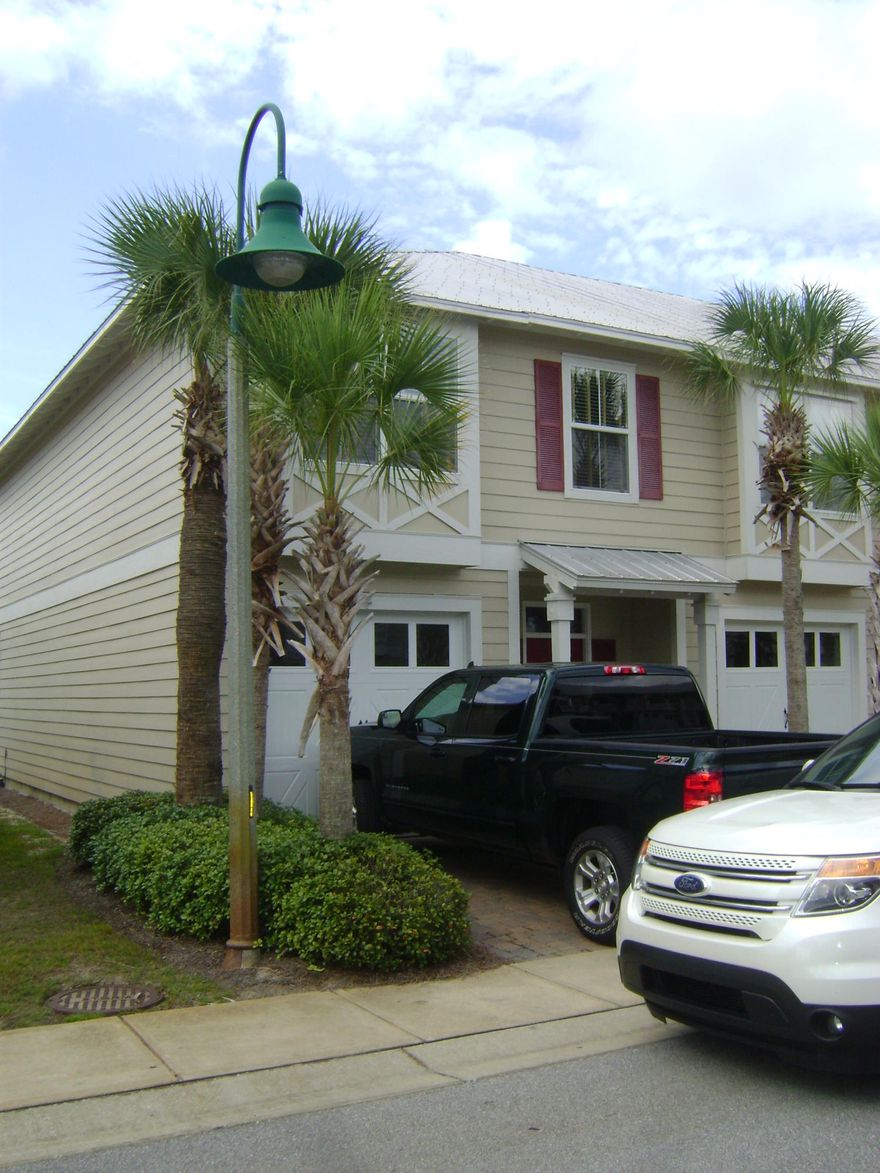 THIS IS AN END UNIT! Hardie Plank Siding, Galvanized Metal Roofs, and Southern Plantation Shutters. Private Covered Patio @ Rear and Covered Front Porch. The entire townhome has beautiful wood laminate flooring and new carpet on the stairs, 9 Foot Ceilings, 8 Foot Interior Doors, Bull Nose Corners and Decorative Crown Molding. Living Room Pre Wired for Media Surround Sound. Kitchen features upgraded Wood Cabinetry, Granite Counter Tops & Breakfast Bar, Tiled Back Splash and Stainless Steel Appliances approximately 1 year old. All new toilets, cabinets, mirrors and sinks in all bathrooms. Upgraded ceiling fans and light fixtures throughout. Buyer to verify all measurements and information deemed important.