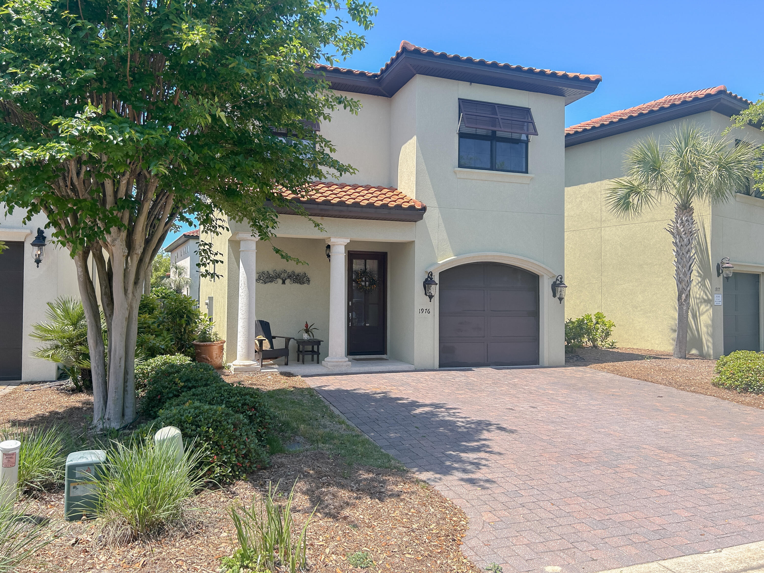 Embrace the allure of coastal elegance in this exquisitely maintained home nestled within the prestigious, gated enclave of Sandestin Golf and Beach Resort. The interior showcases elevated wood-look ceramic tile on the main level and refined hardwood flooring upstairs. The gourmet kitchen boasts a new range, gleaming granite countertops, custom tilework, and generous cabinetry. The expansive primary suite features a versatile flex room, ideal for a home office, personal gym, or cozy reading nook. Each bedroom is thoughtfully appointed with its own en-suite bathroom, ensuring both privacy and luxury. Revel in the tranquility of a secluded patio offering picturesque fountain views, perfect for al fresco dining or unwinding. Additional features include a one-car garage, a new HVAC syst providing full access to the resort facilities. Experience an unparalleled lifestyle in Sandestin, where luxury, convenience, and community come together seamlessly. With nearly everything accessible by golf cart, you'll have easy access to private white sand beaches and emerald waters, four championship golf courses, tennis and pickleball courts, fitness centers, and miles of walking and biking trails. The full-service private marina offers opportunities for boating, fishing, paddle boarding, kayaking, and sunset cruises. Grand Boulevard and The Village of Baytowne Wharf provide diverse dining options, live music, shopping, and family events. With over 25 restaurants, boutique stores, grocery options, and everyday necessities, everything is within reach. Medical and wellness clinics, doctors' offices, and a hospital are also conveniently accessible by golf cart. Whether you're heading for a beach day, a marina adventure, a shopping spree, or an evening out, you can do it all without needing your car. Ideal as a primary residence or a second home, either way, this coastal jewel is ready to welcome you.