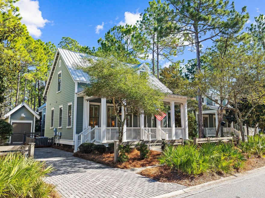 This exquisite Florida cottage in the heart of WaterColor welcomes you with a grand, elongated driveway, leading to a golf cart garage and ample space for an addition of a carriage house or private pool with HOA approval. The timeless allure of this property is immediately evident, with an expansive front porch that gazes across a serene, protected green space, ensuring privacy and unspoiled views. As you step inside, you are greeted by an ambiance of understated elegance, masterfully curated by Lovelace Interiors under the vision of Lindsay Miller Cannon. The interiors are elevated with designer furnishings, rich hardwood floors, custom plantation shutters, and bespoke lighting, creating a refined yet inviting atmosphere. The thoughtful layout includes a newly added breakfast nook adjacent to the kitchen, which serves asan intimate space for casual dining that complements the formal dining area. A sophisticated corner wet bar, complete with a Sub-Zero wine cooler and ice maker, offers a touch of opulence, perfect for entertaining guests. The gourmet kitchen is a culinary enthusiast's dream, now enhanced with a brand-new refrigerator and dishwasher. It boasts stainless steel appliances, luxurious granite countertops, and abundant storage, catering to both quick family meals and elaborate dinner parties.

The home's seamless flow leads you to a spacious first-floor master suite, while the second level reveals three beautifully appointed guest bedrooms and an inviting loft beneath the home's distinctive hip roof. Each bathroom has been tastefully updated with exquisite granite vanities, indulgent tubs, thoughtfully designed showers with handheld attachments, all bathed in the glow of custom lighting. Upstairs, you will also find more than 100 square feet of bonus heated and cooled storage space, not included in the total square footage calculation.

The true beauty of this property, however, lies in its exceptional outdoor living spaces. A screened-in porch invites year-round relaxation, seamlessly extending to a paver patio surrounded by mature pines, creating a private, tranquil retreat. Whether hosting alfresco dinners, gathering around the fire pit, or simply listening to birdsong, this outdoor oasis is designed for both leisure and entertaining. The thoughtfully positioned outdoor shower, conveniently located near the golf cart garage, is ideal for rinsing off after a day at WaterColor's resort-style pool or a sun-soaked afternoon at the beach.

This WaterColor masterpiece is more than just a home,it's a lifestyle. Discover unparalleled elegance, privacy, and luxury living in one of Florida's most sought-after communities.