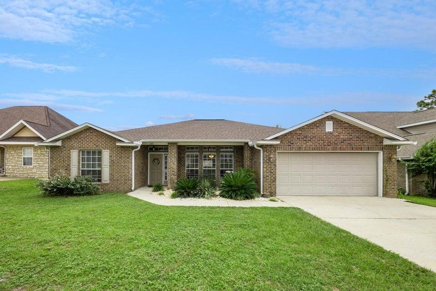 Nestled in an ideal location south of I-10, this well-maintained, brick residence promises swift access to bases, beaches, schools, shopping, and more, ensuring a perfect blend of convenience and relaxation. Step inside to discover an inviting open floor plan adorned with vaulted ceilings and large windows that flood the space with natural light, arched doorways, neutral paint, and solid flooring throughout, creating an expansive and airy ambiance. Privacy is paramount with the thoughtfully designed split bedroom layout, while ample storage solutions abound in the bedrooms and the generous walk-in pantry.Indulge your culinary desires in the eat-in kitchen, equipped with stainless steel appliances, an island, breakfast bar, pantry, plenty of cabinets, and elegant granite countertops.