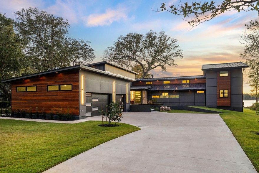 Tucked away on nearly an acre fronting Boggy Bayou, this architectural masterpiece embodies the perfect balance of luxury, tranquility, and thoughtful design. Completely reimagined and expanded in 2024 by SMP Architecture and brought to life by Hughes Construction Group, the residence blends a striking mix of concrete, Hardie board, Brazilian Cumaru wood, and stone for a sophisticated, modern exterior that harmonizes with its lush surroundings. Every element--from the hand-selected natural materials to the precision of the renovation--was chosen to create a serene, cohesive retreat that feels both artful and functional.  Step through the custom pivoting solid wood door into a calm, open interior grounded in natural texturesEuropean oak floors, rectified porcelain tile, tumbled stone, sealed concrete, and custom walnut cabinetry. Frameless doors and hidden storage lend a seamless, minimalist flow, while statement features like the hand-poured 3D concrete fireplace and carved limestone sink from Spain showcase craftsmanship at every turn. The kitchen is both a chef's dream and a design showpiece, featuring quartzite and Dekton countertops with a custom sinker cypress table, an AGA 48" induction cooktop, Fisher & Paykel and Thermador appliances, and a concealed walk-in pantry with cooler drawers, wine storage and coffee nook. Just beyond, the living spaces open to a spacious screened lanai with a Brazilian Cumaru tongue-and-groove ceiling, outdoor kitchen and panoramic water views.

Located on the first level, the primary suite offers a spa-inspired escape, complete with a concrete soaking tub and multi-head custom shower, dual custom walnut vanities, a walk-in closet, water views and direct access to the waterfront porch. Two additional bedrooms with a shared full bathroom are conveniently located on the first floor. A second-story private guest suite offers a quiet haven with its own ensuite bath, walk-in closet and a private balcony overlooking the bayideal for guests seeking solitude and water views. Across the home, an additional second-level features another guest suite with ensuite bath, plus a dedicated wellness retreat. This calming space includes a wet bar, massage table, cork flooring, a Sunlighten infrared sauna and plumbing for a future cold plunge, all oriented toward peaceful water vistascreating a spa-like sanctuary within the home. A dedicated gym space and laundry room lead to an oversized garage including an EV-ready 220 plug, built-in pressure washer for convenient vehicle washing and storage.

Outside, the property continues to impress with a Cumaru and stone shower, citrus trees, and a regulation-sized sand volleyball court. The 150' Thruflow dock features deep water access, jet ski lift, and power and water serviceready for days spent boating to Destin Harbor, Crab Island, or the open Gulf, all just minutes away. Enjoy the best of both worldspeaceful waterfront living in the heart of Niceville, with the dining, shopping, and white-sand beaches of Destin just across the bay. Every detail of 1435 Bayshore Drive was designed for comfort, longevity, and the effortless enjoyment of coastal living.
