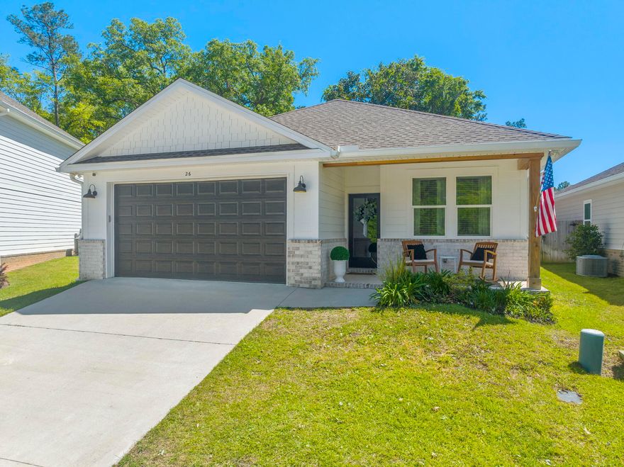 Welcome to 26 Sandywoods Ct in Freeport, FL! Located on a cul-de-sac, this charming 3-bedroom, 2-bathroom home offers a cozy retreat for those seeking a modern home with an abundance of custom accents and upgrades. The house features shiplap accent walls that add a touch of character to the living space, master bedroom and bathrooms. Step outside to enjoy the fenced back yard, perfect for relaxing or entertaining guests. Residents of this community have access to a playground, community pool, and fishing dock, as well as a community path leading to the creek which opens up to he bay! Don't miss out on the chance to make this lovely house your new home!**Pink bathroom accent wall to be painted neutral color