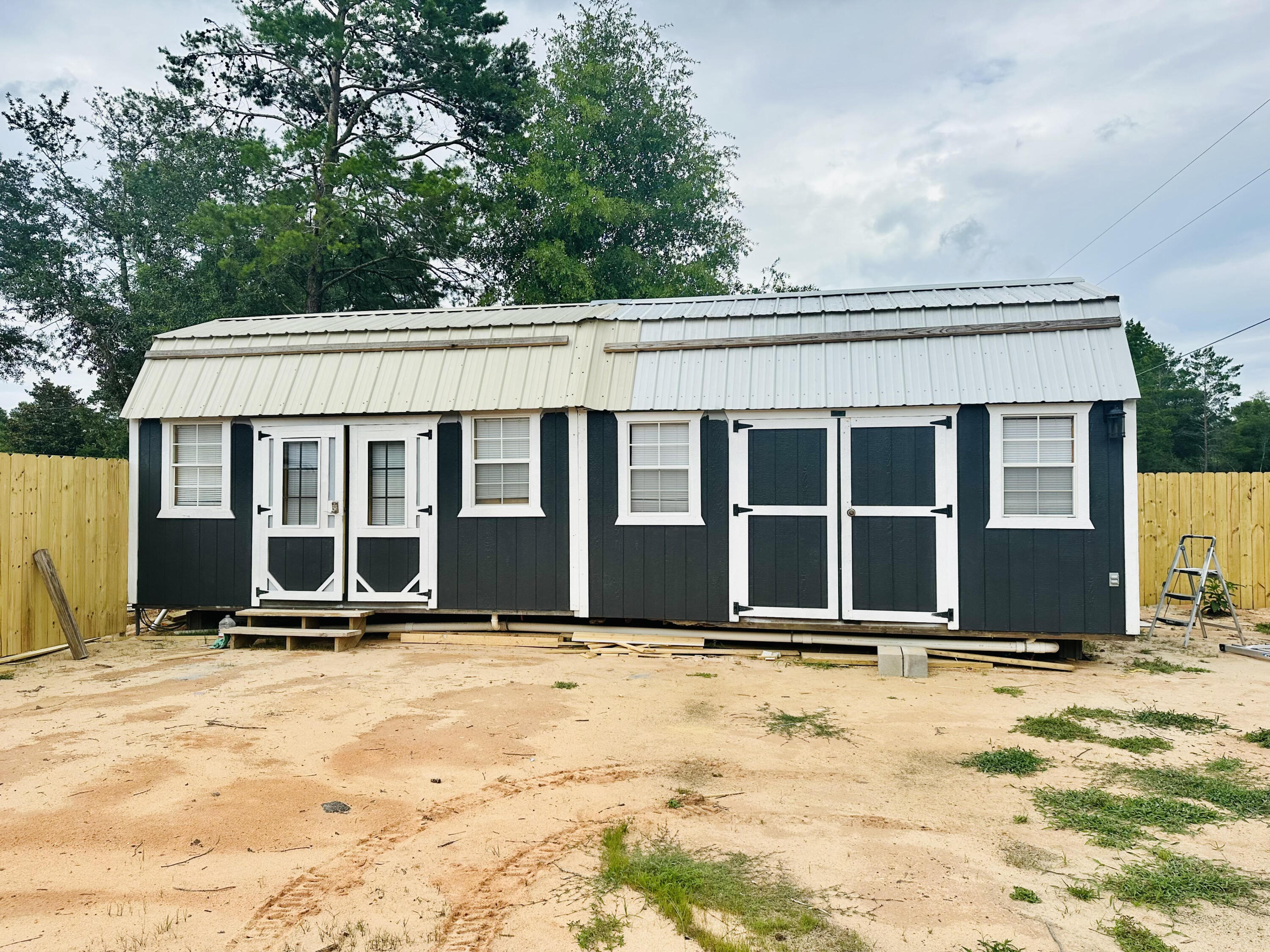 Enjoy cozy, efficient living in this 1 bedroom, 1 bath tiny house. The open floor plan maximizes space, featuring a modern kitchen, comfortable bedroom with a built-in closet, and a stylish bathroom. Perfect for a minimalist lifestyle without sacrificing comfort. Lease includes $150 credit towards utilities with any overage to be paid by tenant directly to owner. Application required. Requirements include one year of employment, 600 credit score minimum and monthly household income of $2375.