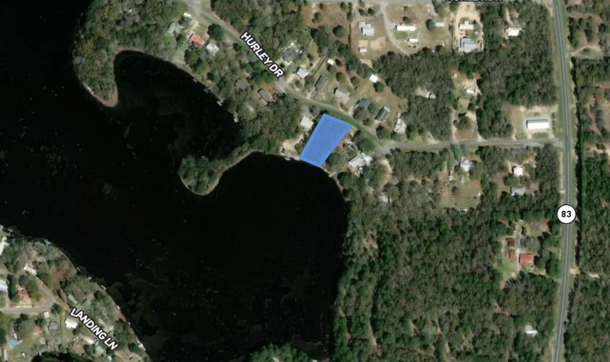 WATERFRONT! Beautiful Juniper Lake Lot! Rare opportunity to be right on the water in Defuniak Springs. This lot is .43 acres and is fully wooded. Zoned Urban Residential which is perfect for a single family home, vacation home or airbnb rental home. Lot has power at the street but will need well and septic installed. The lot right next door is available with septic and well ready to go. Both lots available in package deal.