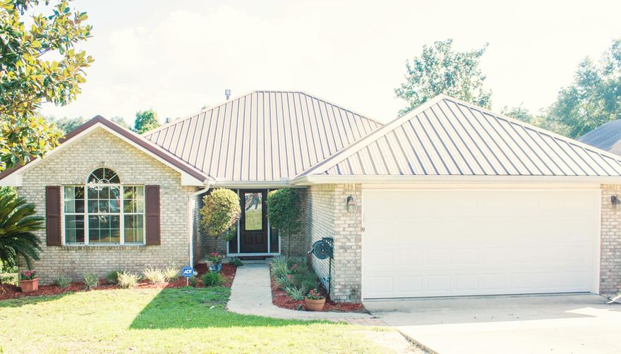 Are you looking for an adorable home in the HEART of Niceville? Your search is over! You've found it in this 3 bedroom, 2 bath house with a BONUS ROOM. This recently upgraded, split bedroom floor plan offers plenty of space and comfort. You enter the home into the open living room, where you will notice the stylish laminate wood flooring, raised ceiling with crown molding, decorative mantle and gas fireplace. Surround sound is also available for your entertainment needs. The kitchen features granite countertops, a breakfast bar, and a beautifully tiled backsplash, along with stainless Kitchen Aid and Kenmore Elite appliances. The dining room is located off the kitchen, and it flows into the BONUS ROOM, which is lined with windows and offers natural light and added space for an office,