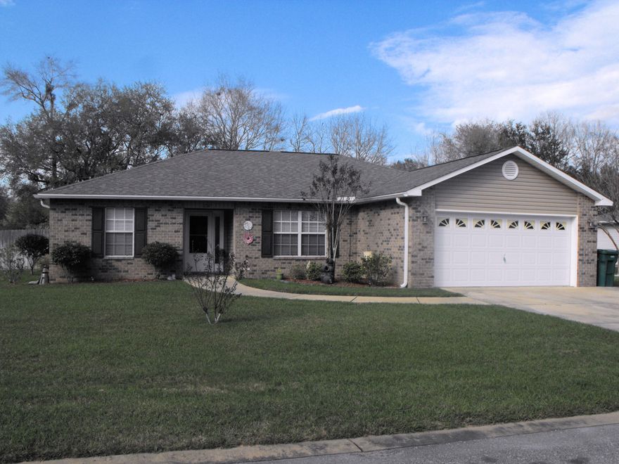 Beautiful home on over 1/2 acre corner lot in the North end of Crestview. Walk into the living area with 10'ceilings. Carpet in the living room and bedrooms. 18X18 Porcelain tile in the kitchen, laundry room, and bathrooms. Granite counter tops in the kitchen and designer maple cabinetry. Master bedroom has trayed ceiling with crown molding. Walk out onto the large covered patio overlooking a well manicured lawn. Also includes a transferable termite bond. This is beautiful country living in a quiet neighborhood.