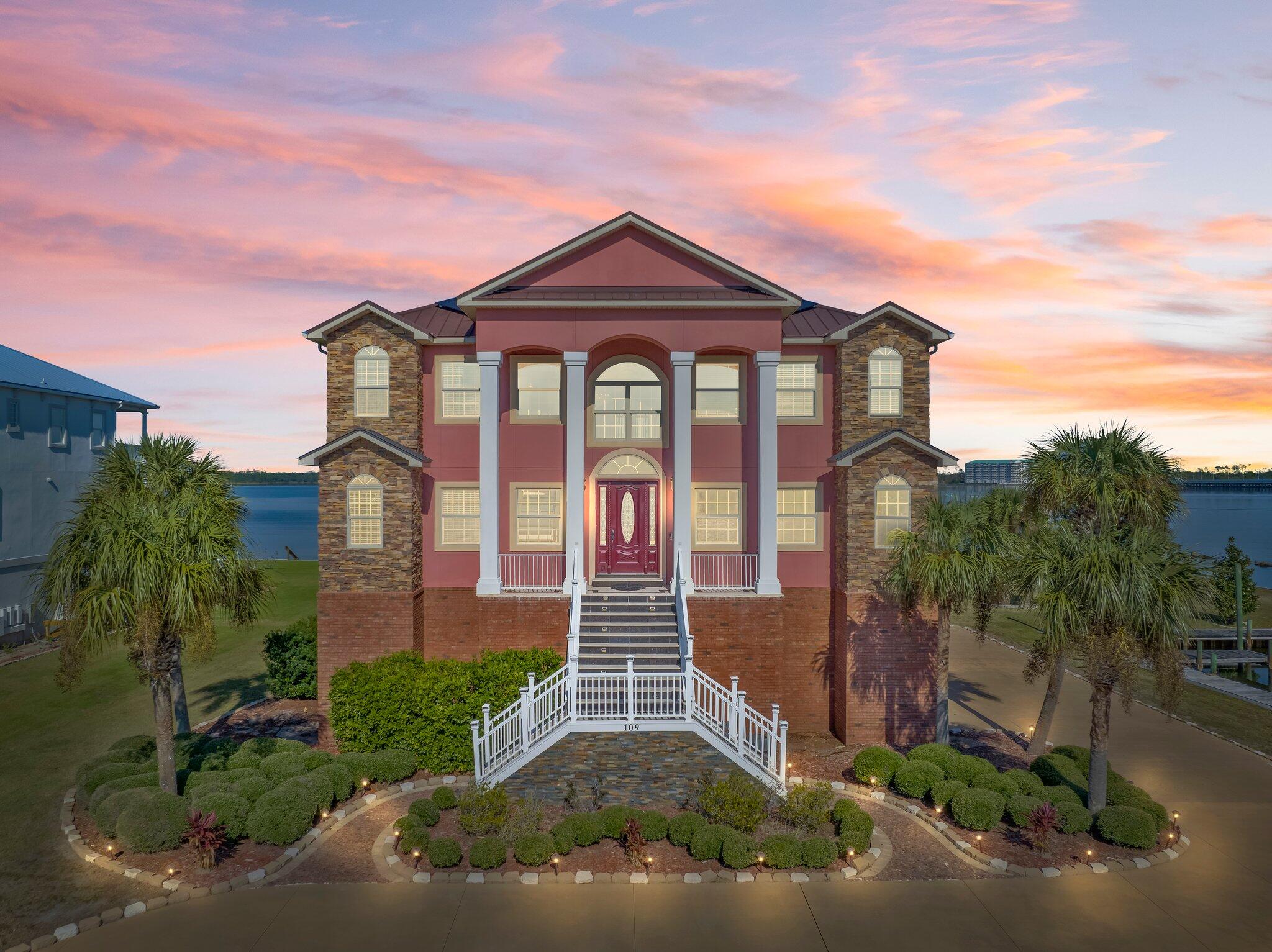 Luxury at its finest! This magnificent 3 level home with stunning exposure to North Bay (190 ft) delivers all the sumptuousness your heart desires. It is a boater's dream property, not only because of the Bay but a deep access canal with approximately 85 ft of dock (slip 11.5 x 21). All waterfront exposure has extraordinary seawall protection. Who says you can't have everything? Aside from the awesome waterfront exposure you have tremendous open yard space, the access entry to the home is quiet and tucked away, circular concrete drive and plenty of extra driveway parking for extracurricular vehicles (RV's, boats).The garage is oversized three car + and elevator access is immediately available from the interior garage entry and services all 3 floors.