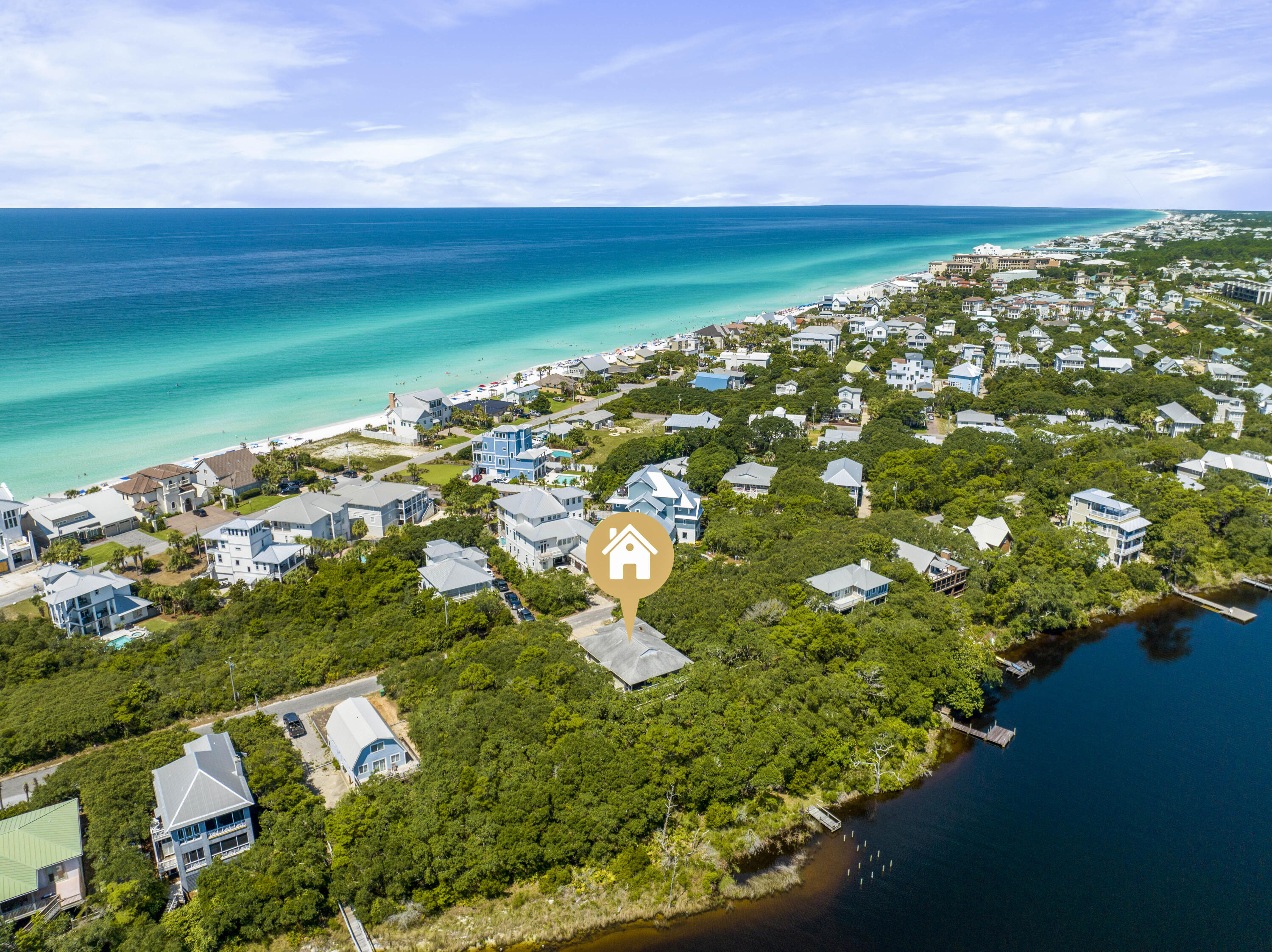 Nature Lover's Dream! Lovingly cared for lakefront beauty in the Old Blue Mountain Beach neighborhood harkens back to the 30A of yesteryear. Built high up on the bluff overlooking the lake, this strong and sturdy home has withstood the test of time. Currently set up as a three bedroom house with a two bedroom apartment, it could easily be reconfigured to a five bedroom house. The large two car garage has room for all your beach toys. Also there is a full sized space underneath the house with a view of the lake that could be screened and turned into an outdoor recreation room. Five neighborhood beach accesses are a short distance away and no busy roads to cross make a day at the beach a breeze!