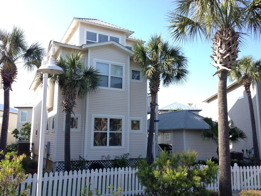 REDUCED!! 3 story, 3 BR, 3 Baths, Gulf VIEWS from tower! Close to everything & yet 'tucked' away in an intimate setting & STRONG rental income! This lovingly cared for cottage has special upgrades & touches. Hardwood floors & tile throughout. Each BR has it's own private porch! Sold Fully Furnished! Short Term Rental Income 2013 & 2014 - $40,000+ Gulfside Cottages is a community of 29 homes located in Miramar Beach. Steps from the beach, with direct beach access from within the community, and/or from the beach access on Open Gulf Street. Neighborhood has sidewalks, picket fences, street lights, extensive tropical landscaping, an architecturally accented entrance designed for restricted access, a community 'heated' pool, and each cottage has a carport & storage closet.