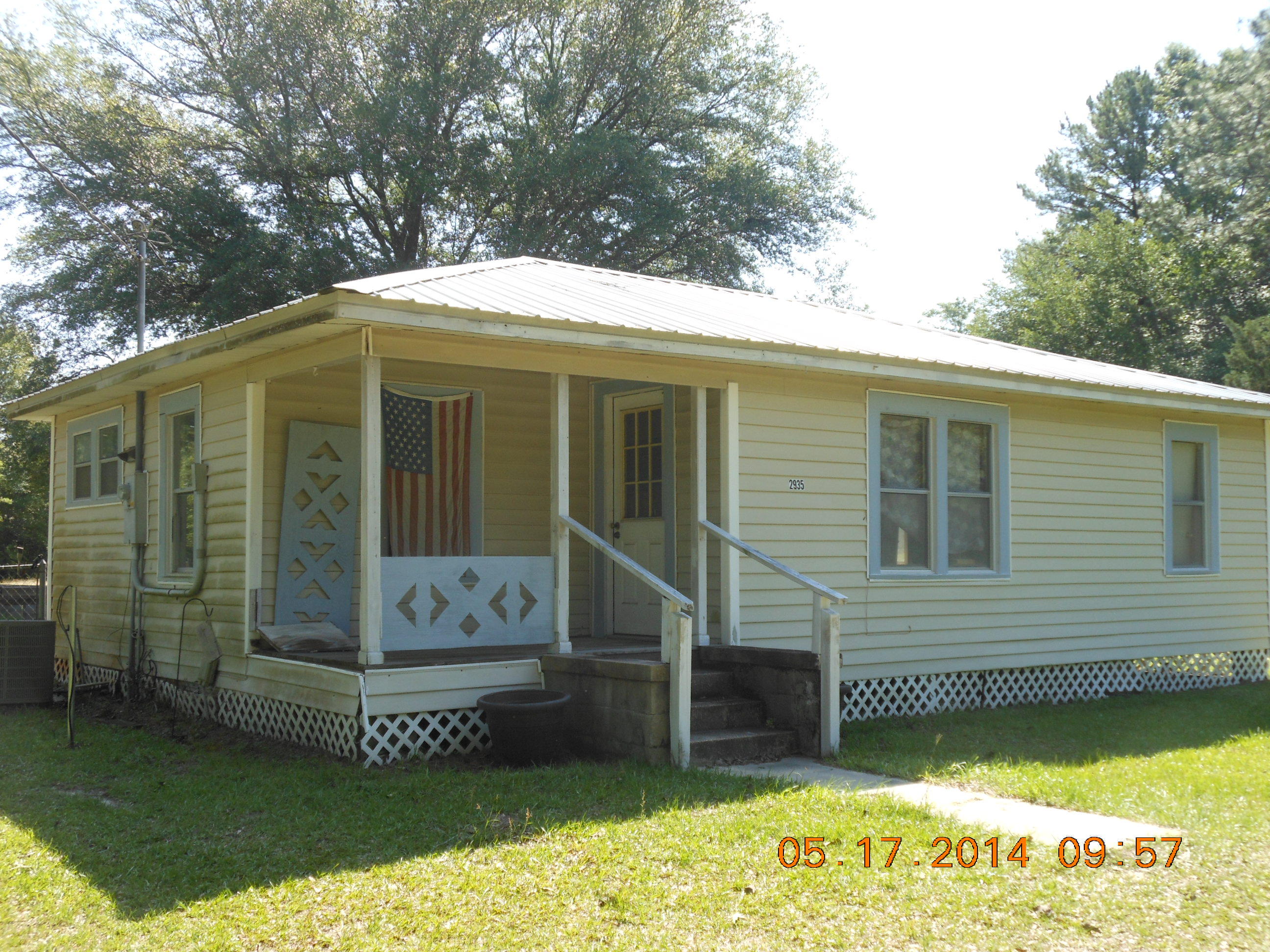 REDUCED BY $7,000! Home updated with vinyl siding, windows, metal roof. Interior needs finishing floors, plumbing in bathroom and insulation. Tub for bath and kitchen cabinets are in home but not installed. Central heat/air was put in ten years ago. Newer water heater. 750 gallon septic tank and new drainfill was installed 3 years ago. Home fronts paved road near Ponce de Leon springs and Morrison Springs. 2.5 acres is cleared and no restrictions. City water. 20 x 20 reinforced concrete garage pad. 30 x 20 concrete foundation that could be made into workshop, guest house, etc. Seller has 1952 Ford 8N tractor, bush hog, box blade,lift & 21 ft flatbed trailer if anyone interested in buying separately...