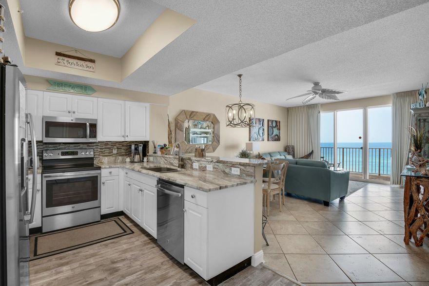 Enjoy waking up in the morning to DIRECT GULF views from the master bedroom without the price tag of being Gulf-front - this UPGRADED condo offers DIRECT GULF views from the living, kitchen, & MASTER BEDROOM, and is perfectly positioned on the 5th floor of the A building of Majestic Sun which is securely tucked behind the private gates of Seascape Resort. This WELL-MAINTAINED and RENTAL READY east end condo makes the perfect second home or vacation rental property with a SOLID RENTAL HISTORY and a gross rental projection of $51K+. The EXPANSIVE balcony with a nice breeze off the Gulf makes the perfect setting to watch the sunrise and sunset! Matching stainless steel GE appliances in the spacious kitchen, granite countertops throughout including the bathrooms, and NEW PERGO MAX laminate